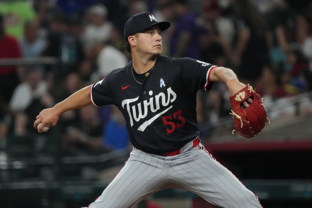 Minnesota Twins pitcher Mike Paredes throws against the Arizona Diamondbacks in the first inning of a baseball game, Sunday, June 21, 2026, in Phoenix. (AP Photo/Rick Scuteri)