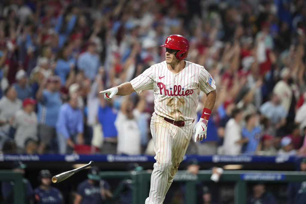 Philadelphia Phillies' J.T. Realmuto reacts after hitting a two-run home run against Seattle Mariners pitcher Matt Brash during the eighth inning of a baseball game Tuesday, Aug. 19, 2025, in Philadelphia. (AP Photo/Matt Slocum)