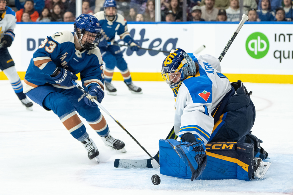 Toronto Sceptres goaltender Raygan Kirk (1) stops Vancouver Goldeneyes' Michelle Karvinen (33) during the first period of an PWHL hockey game in Vancouver, Sunday, March 1, 2026. (Ethan Cairns/The Canadian Press via AP)