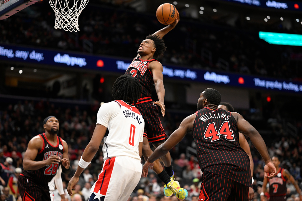 Chicago Bulls guard Collin Sexton attempts a dunk during the first half of an NBA basketball game against the Washington Wizards, Tuesday, April 7, 2026, in Washington. (AP Photo/John McDonnell)