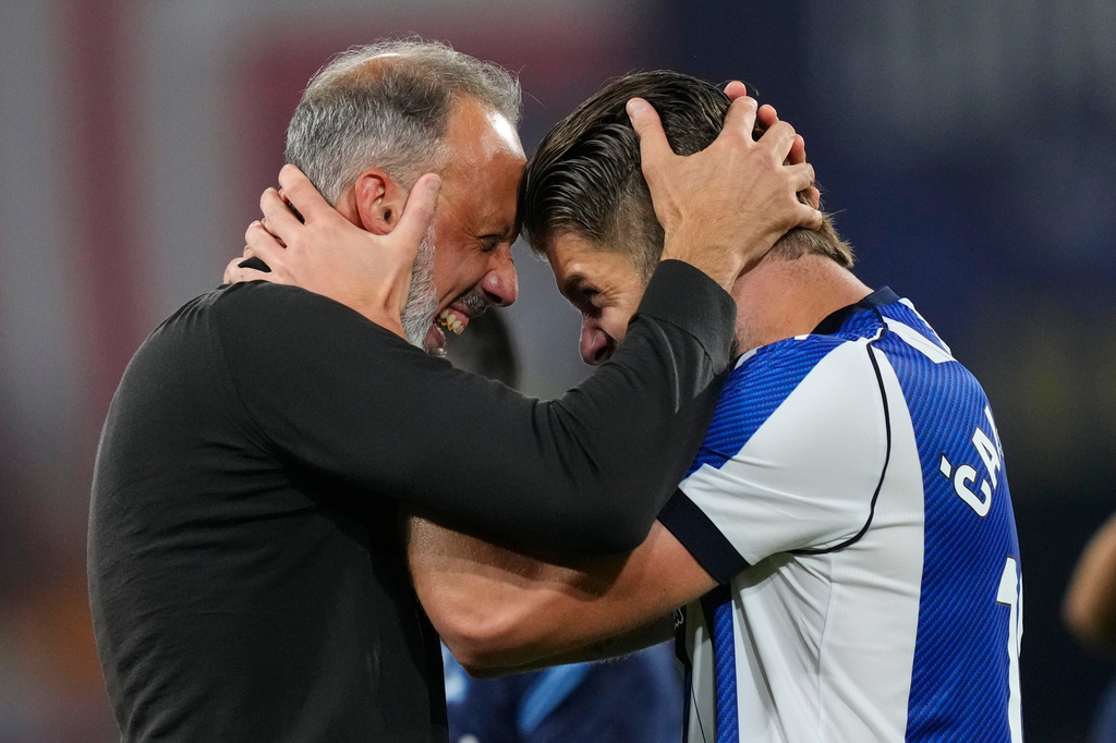 Real Sociedad's head coach Pellegrino Matarazzo, right, celebrates with Duje Caleta-Car after winning the Copa del Rey final soccer match between Atletico Madrid and Real Sociedad in Seville, Spain, Saturday, April. 18, 2026. (AP Photo/Jose Breton)