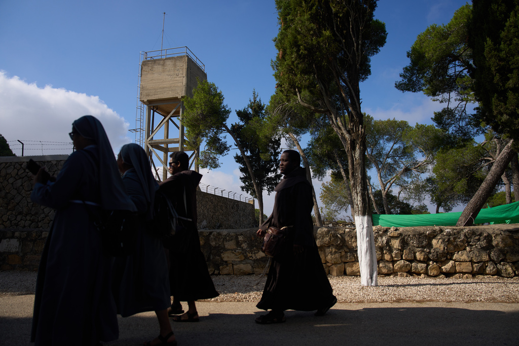 Priests and nuns make their way to the Basilica of the Transfiguration on Mount Tabor, northern Israel, on Aug. 6, 2026. (AP Photo/Ariel Schalit)