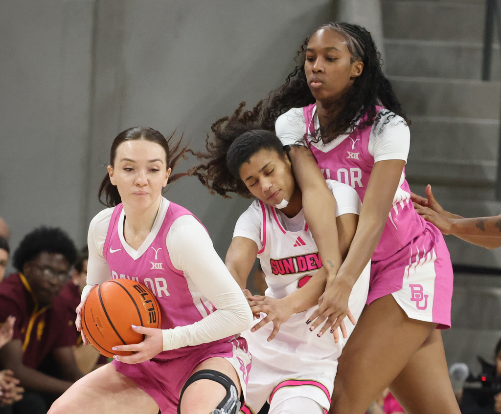 Arizona State guard Amaya Williams is pressured by Baylor forward Kiersten Johnson, right, as Jana Van Gytenbeek, left, looks to pass the ball in the first half of an NCAA college basketball game, Saturday, Feb. 7, 2026, in Waco, Texas. (Rod Aydelotte/Waco Tribune-Herald via AP)