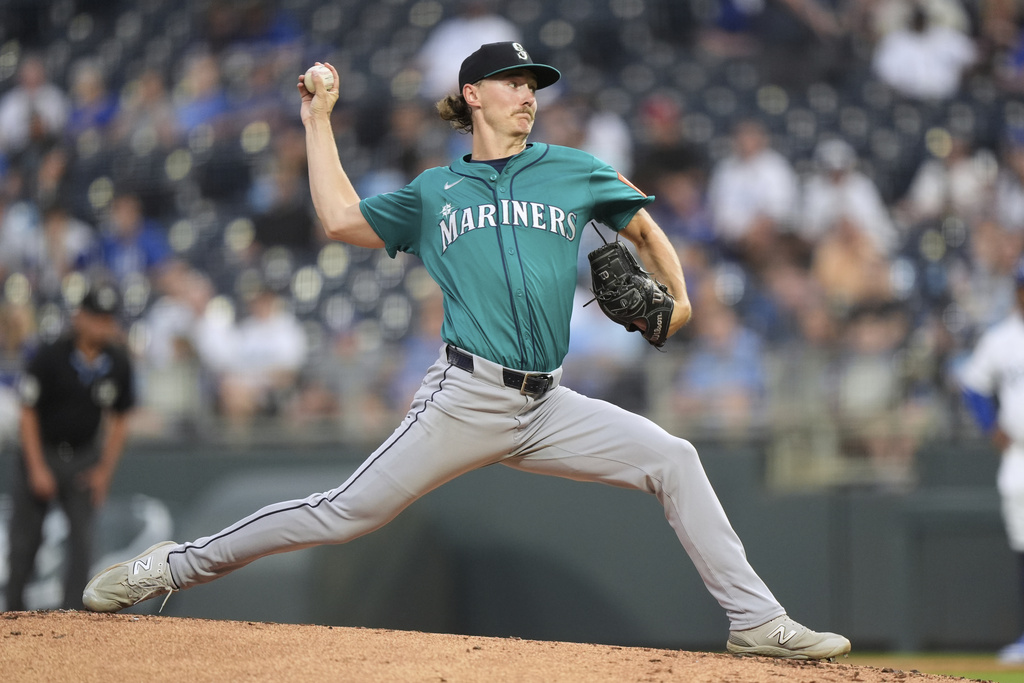 Seattle Mariners starting pitcher Bryce Miller throws during the first inning of a baseball game against the Kansas City Royals, Wednesday, Sept. 17, 2025, in Kansas City, Mo. (AP Photo/Charlie Riedel)