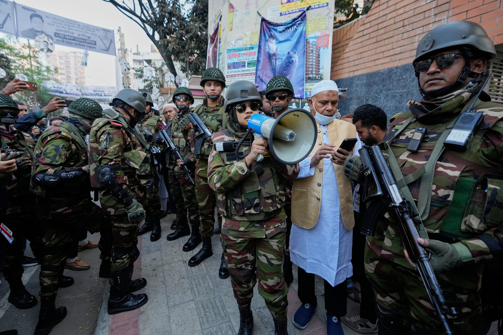 An army official announces to the voters to maintain discipline in a polling station during national parliamentary election in Dhaka, Bangladesh, Thursday, Feb. 12, 2026. (AP Photo/Anupam Nath)