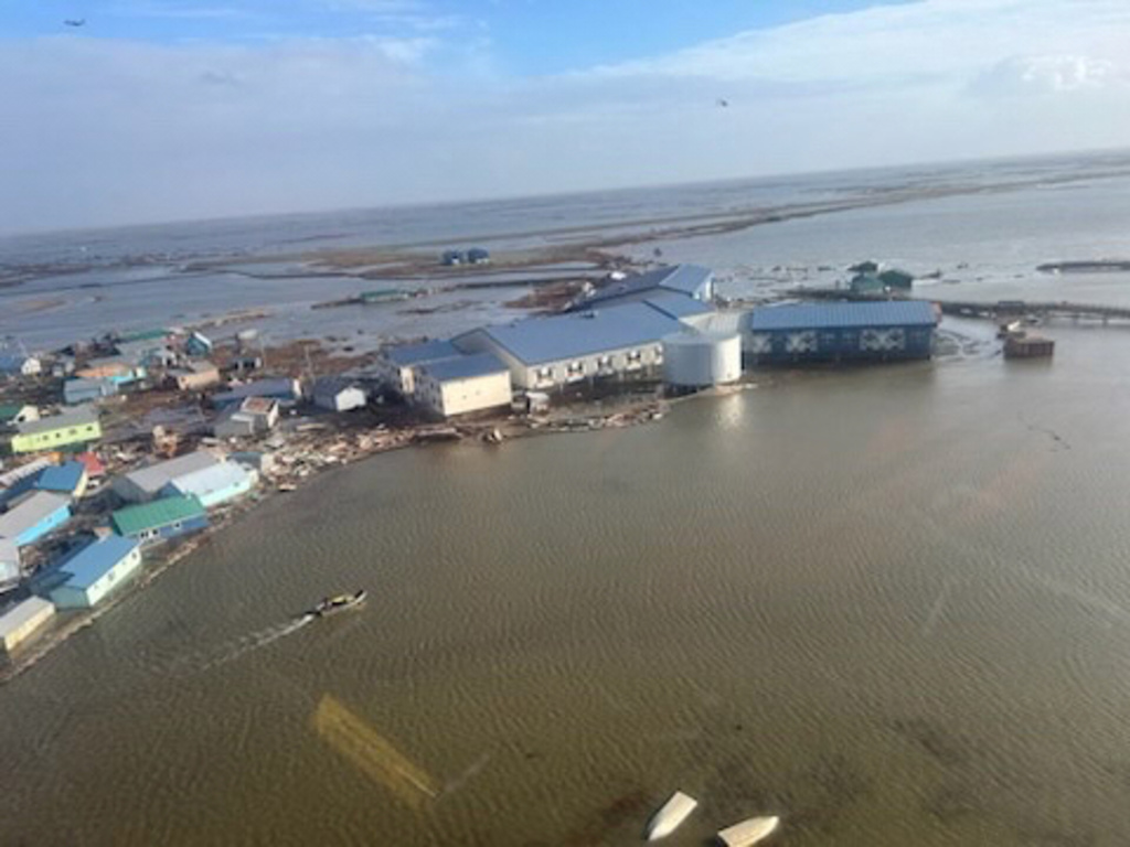 In this photo provided by the U.S. Coast Guard, Kipnuk, Alaska, experiences coastal flooding, Sunday, Oct. 12, 2025. (U.S. Coast Guard via AP)
