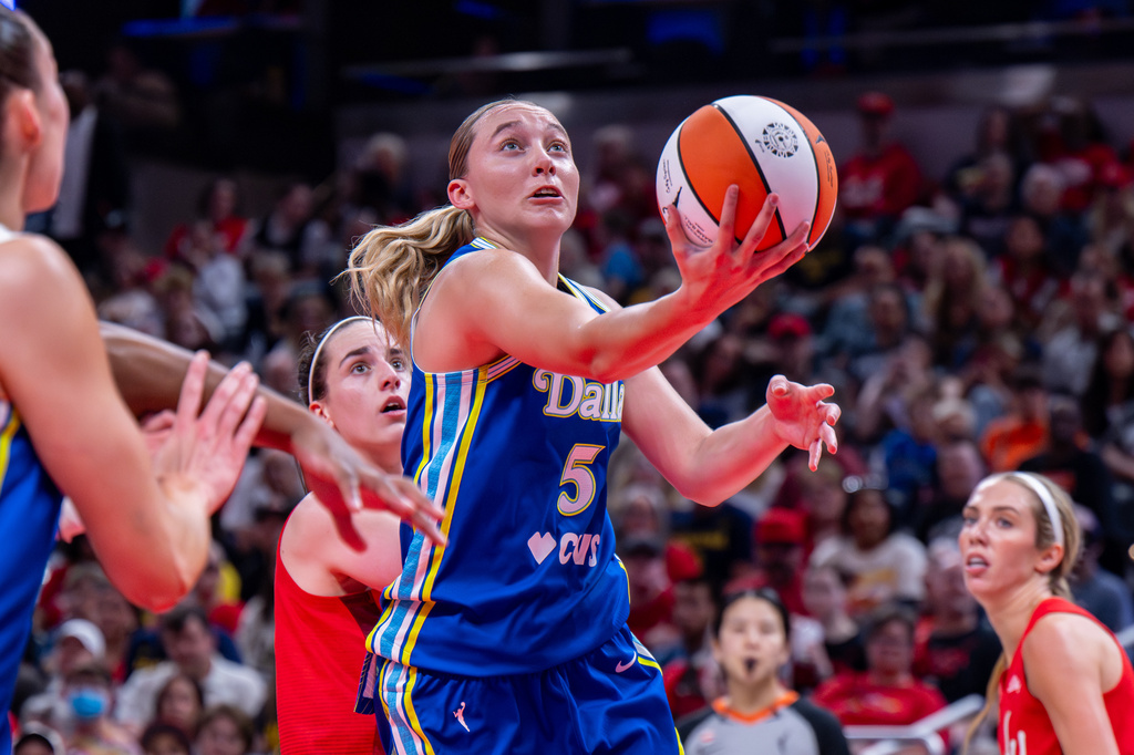 Dallas Wings guard Paige Bueckers (5) looks to shoot during the first half of an WNBA basketball game against the Indiana Fever in Indianapolis, Saturday, May 9, 2026. (AP Photo/Doug McSchooler)