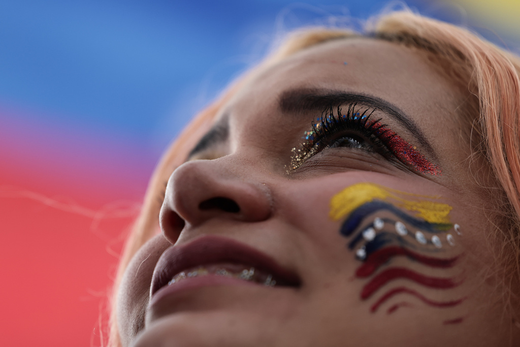 A Venezuelan celebrates in Bogotá, Colombia, Saturday, Jan. 3, 2026, after U.S. President Donald Trump announced that U.S. forces had captured Venezuelan President Nicolás Maduro. (AP Photo/Jose Vargas)
