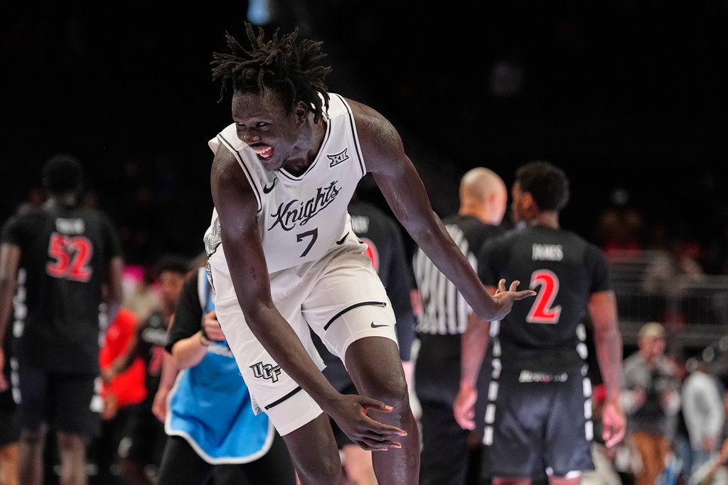 UCF's John Bol celebrates following an NCAA college basketball game against Cincinnati in the second round of the Big 12 Conference tournament Wednesday, March 11, 2026, in Kansas City, Mo. (AP Photo/Charlie Riedel)