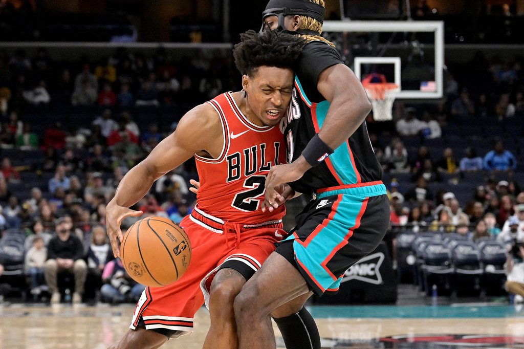 Chicago Bulls guard Collin Sexton (2) drives against Memphis Grizzlies guard Jahmai Mashack, right, in the first half of an NBA basketball game Saturday, March 28, 2026, in Memphis, Tenn. (AP Photo/Brandon Dill)