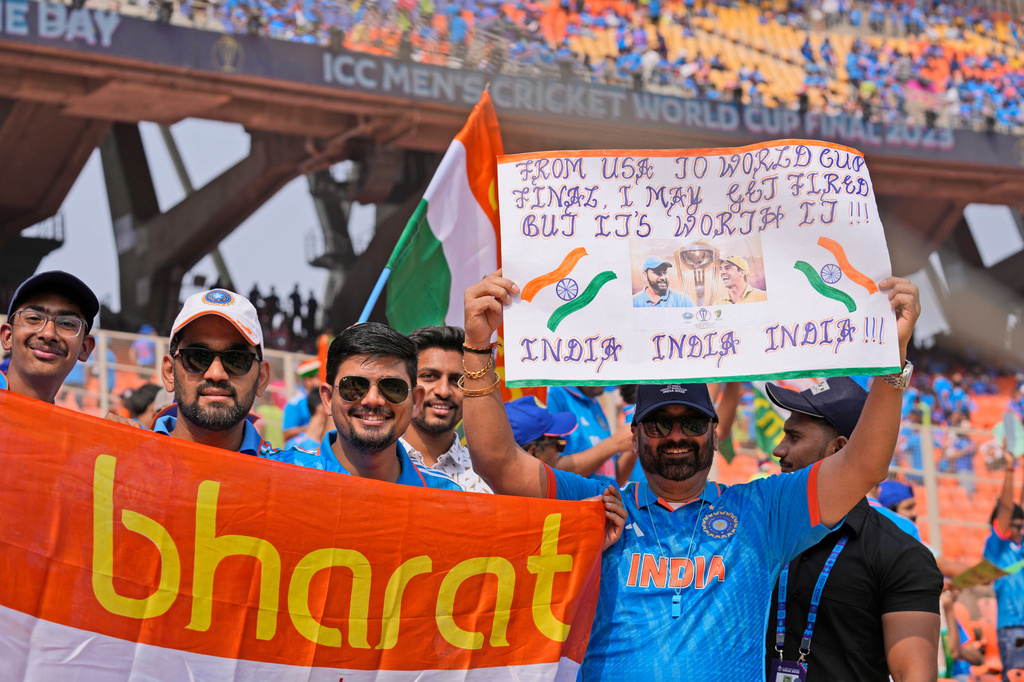 FILE - Indian cricket fans cheer holding banners and posters as they arrive at the stadium hours before the start of the ICC Men's Cricket World Cup final match between India and Australia in Ahmedabad, India, Sunday, Nov.19, 2023. (AP Photo/Aijaz Rahi,File)