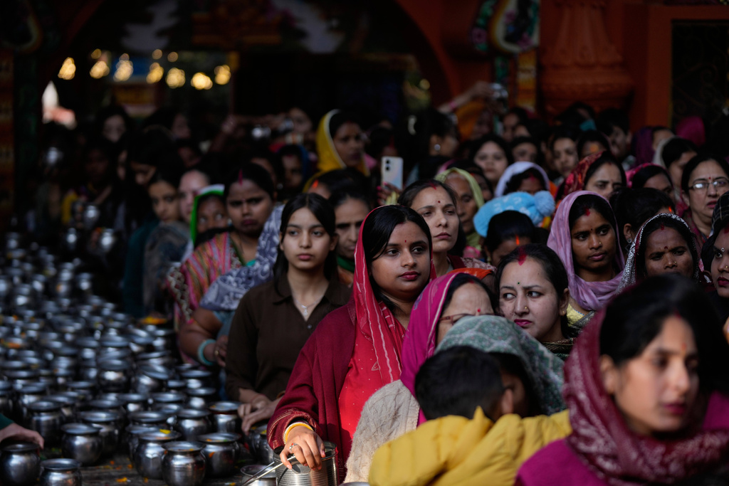 Hindu devotees queue inside a temple to offer prayers during Shivratri, the sacred night dedicated to Lord Shiva in Jammu, India, Sunday, Feb. 15, 2026. (AP Photo/Channi Anand)