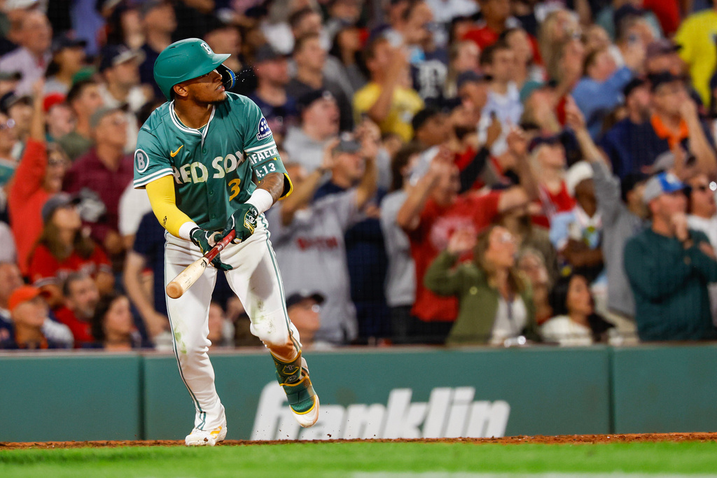 Boston Red Sox outfielder Ceddanne Rafaela (3) reacts to hitting an RBI triple in the ninth inning of a baseball game against the Detroit Tigers, Friday, Sept. 26, 2025, in Boston. (AP Photo/Greg M. Cooper)