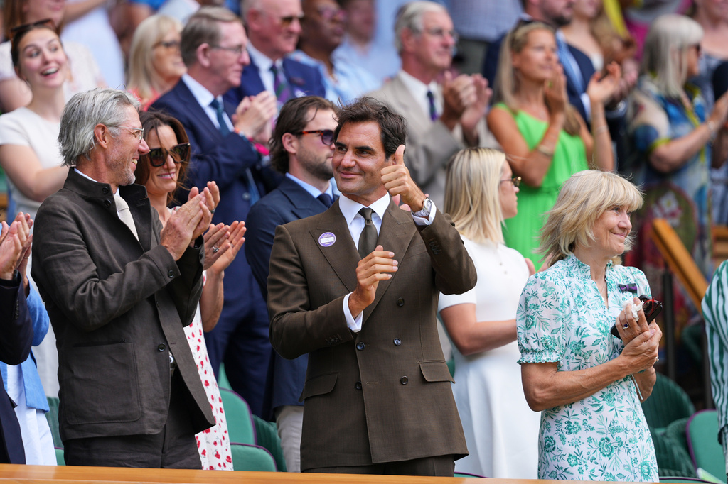 Former tennis player Roger Federer of Switzerland stands in the Royal Box on day eight at the Wimbledon Tennis Championships in London, Monday, July 6, 2026.(AP Photo/Kirsty Wigglesworth)