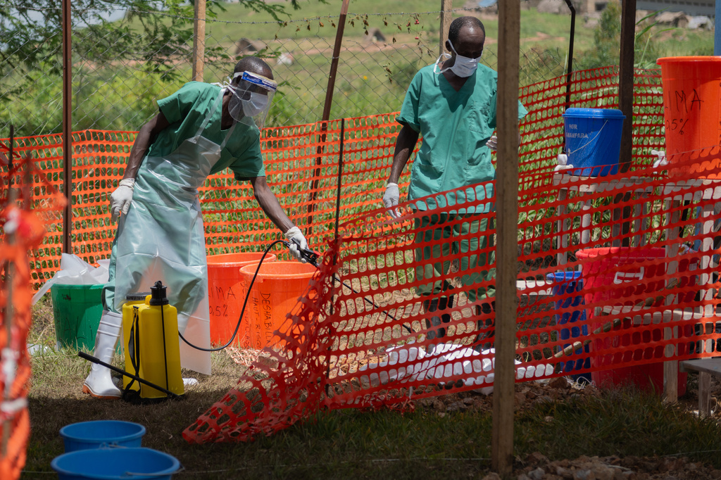 Health workers get ready to start their shift at the Ebola treatment center in Rwampara, Congo, Friday, May 29, 2026. (AP Photo/Moses Sawasawa)