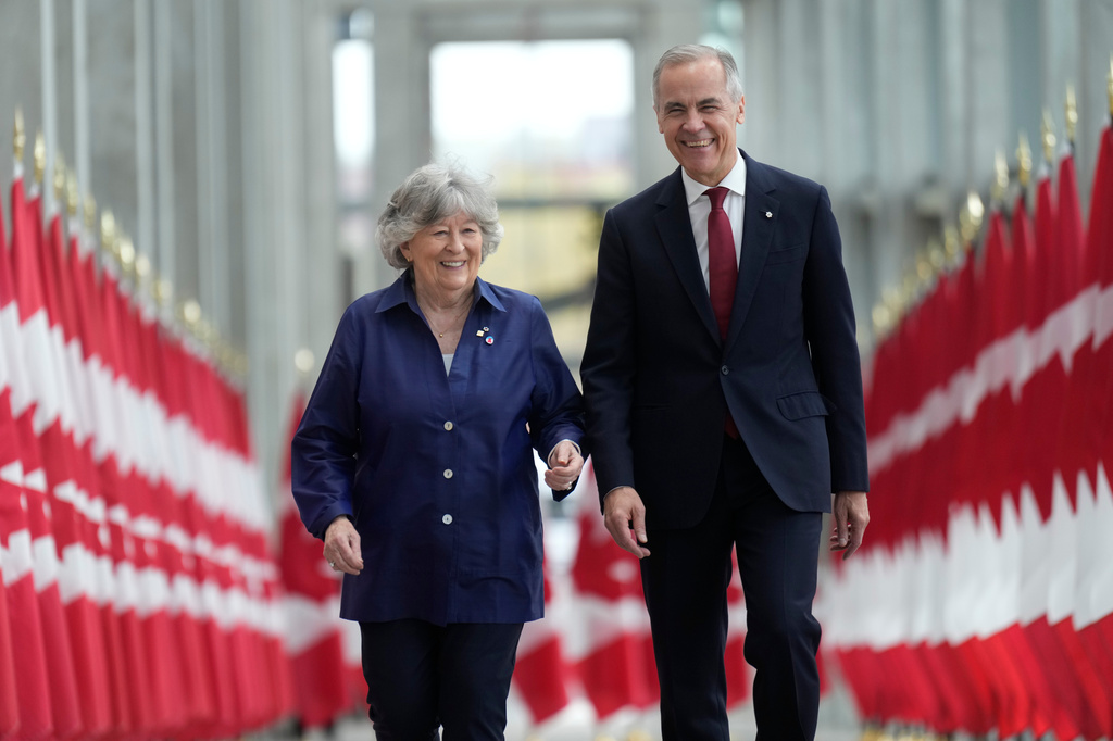 Canada Prime Minister Mark Carney walks with Louise Arbour to announce the new governor general during an event in Ottawa, Tuesday, May 5 2026. (Adrian Wyld/The Canadian Press via AP)