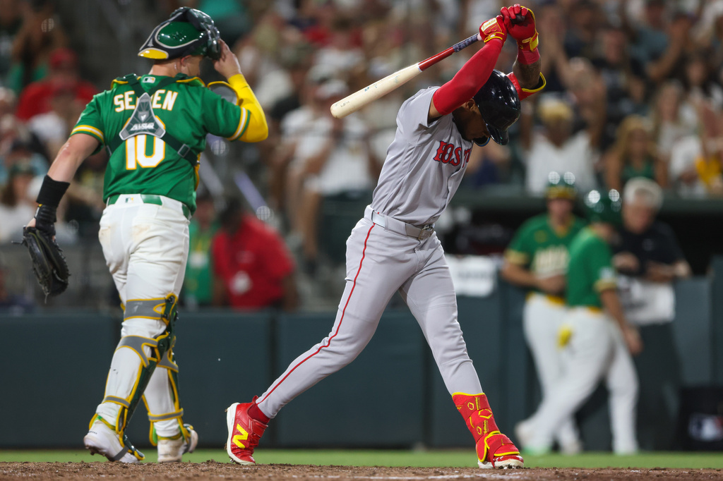 Boston Red Sox's Ceddanne Rafaela, right, reacts after striking out to end the top of the eighth inning of a baseball game against the Athletics Tuesday, July 28, 2026, in West Sacramento, Calif. (AP Photo/Scott Marshall)