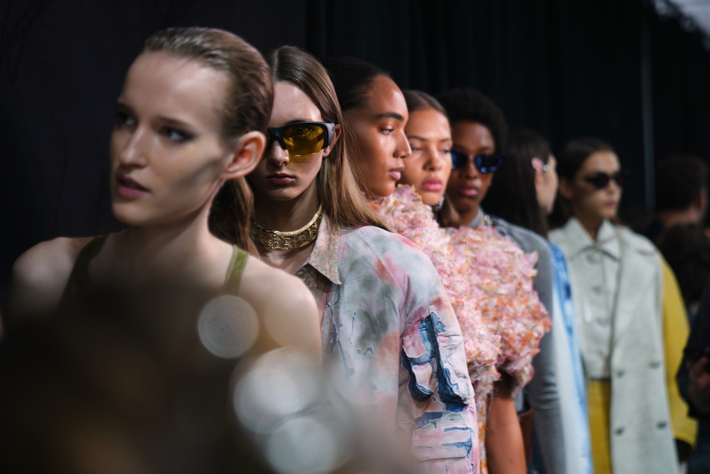 Models wear creations part of the Diesel's Spring Summer 2026 collection in the backstage ahead of the collection's show, in Milan, Italy, Tuesday, Sept. 23, 2025. (AP Photo/Antonio Calanni)