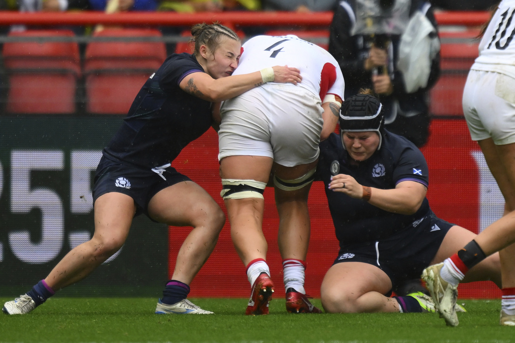 England's Morwenna Talling center, is stopped during the Women's Rugby World Cup 2025 quarterfinal match between England and Scotland in Bristol, England, Sunday, Sept. 14, 2025.(AP Photo/Anthony Upton)