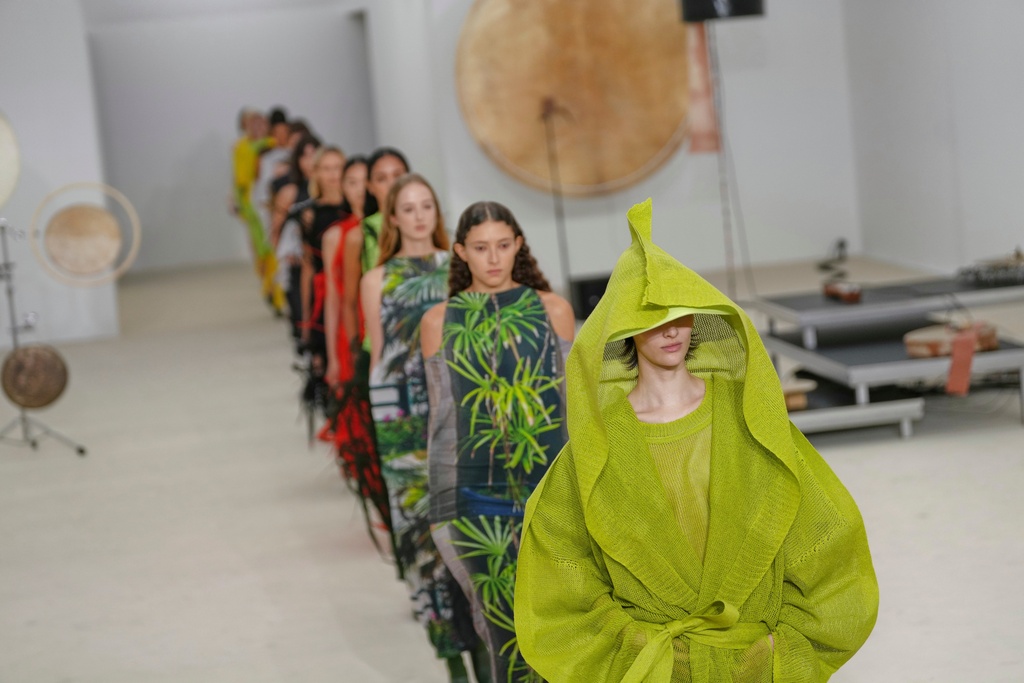 Models wear creations as part of the Issey Miyake Spring/Summer 2026 collection presented in Paris, Friday, Oct. 3, 2025. (AP Photo/Aurelien Morissard)