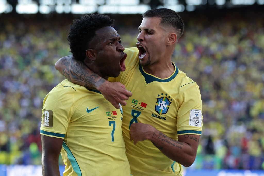 Brazil's Vinicius Junior (7) celebrates with teammate Bruno Guimaraes (8) after scoring during the World Cup Group C soccer match against Morocco in East Rutherford, N.J., near New York, Saturday, June 13, 2026. (AP Photo/Matt Slocum)