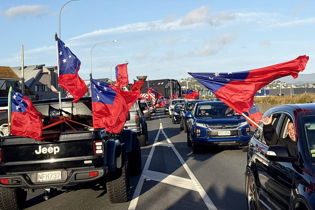 Toa Sāmoa fans react as they drive in convoy through the streets of Lyall Bay in Wellington, New Zealand, Saturday, Nov. 8, 2025 ahead of the Pacific Cup rugby league final against New Zealand in Sydney, Australia, Sunday Nov. 9. (AP Photo/Charlotte Graham-McLay)