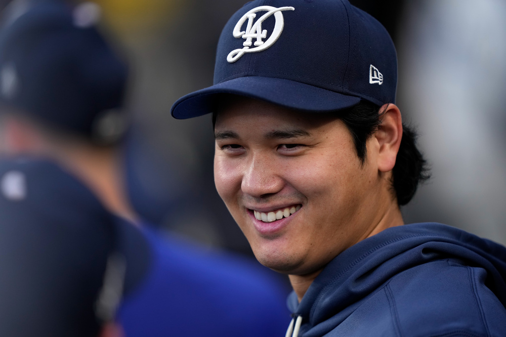 Los Angeles Dodgers' Shohei Ohtani smiles in the dugout during the first inning of a baseball game against the Washington Nationals, Saturday, Sept. 5, 2026, in Los Angeles. (AP Photo/Mark J. Terrill)