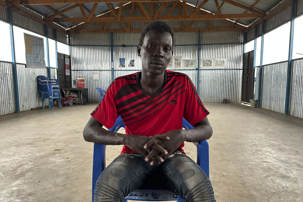 Simon Tong, 39 years-old, who says he was arrested by the Sudanese Armed Forces and tortured during his confinement, poses for a photo during an interview with The Associated Press in Renk, South Sudan, Wednesday, Aug 6, 2025. (AP Photo/Adlai Coleman)