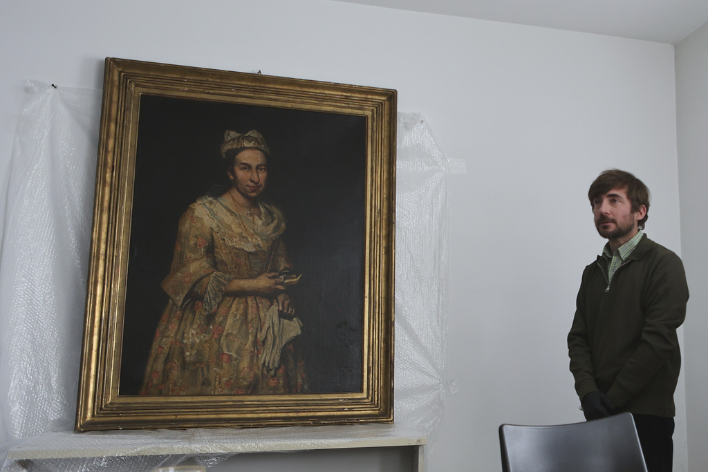 Giuseppe Ghislandi's 18th-century painting "Portrait of a Lady," reportedly stolen by a Nazi officer during World War II and discovered in the home of his daughter after appearing in a real estate listing, is displayed during a press conference by Prosecutor Daniel Adler in Mar del Plata, Argentina, Wednesday, Sept. 3, 2025. (AP Photo/Christian Heit)