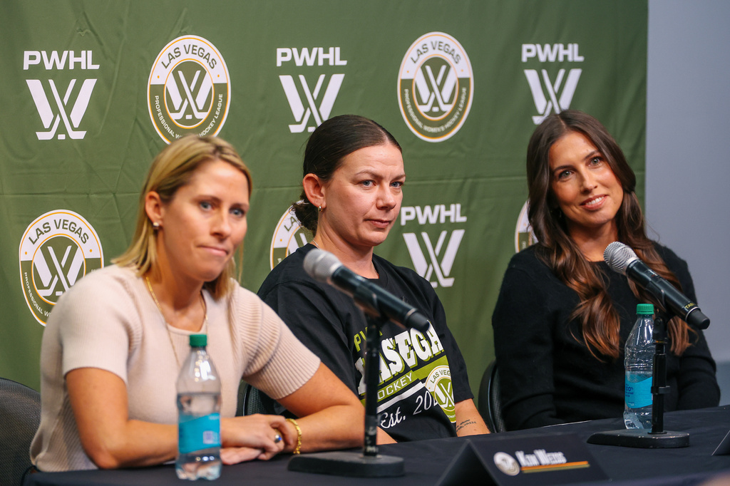 PWHL Las Vegas head coach Kim Weiss, defender Erin Ambrose and general manager Dominique DiDia listen to a reporter's question during PWHL Las Vegas' welcome tour media availability on Wednesday, Sept. 23, 2026, in Las Vegas. (Liv Paggiarino/Las Vegas Review-Journal via AP)