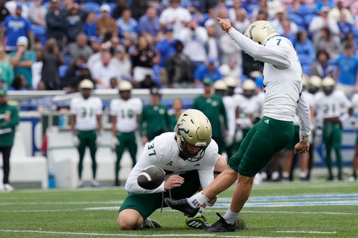 South Florida place-kicker Nico Gramatica (7) kicks a field goal as punter Chase Leon (37) holds during the first half of an NCAA college football game against Memphis, Saturday, Oct. 25, 2025, in Memphis, Tenn. (AP Photo/George Walker IV) South Florida place-kicker Nico Gramatica (7) kicks a field goal as punter Chase Leon (37) holds during the first half of an NCAA college football game against Memphis, Saturday, Oct. 25, 2025, in Memphis, Tenn. (AP Photo/George Walker IV)