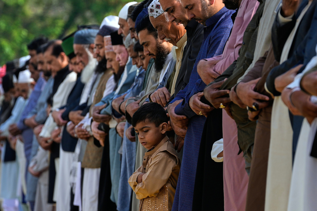 Muslims perform Eid al-Fitr prayer marking the end of the holy fasting month of Ramadan, in Rawalpindi, Pakistan, Saturday, March 21, 2026. (AP Photo/Anjum Naveed)