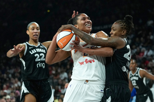 Las Vegas Aces guard Jewell Loyd (24), right, fouls Phoenix Mercury forward Alyssa Thomas (25) during the first half in Game 2 of the WNBA basketball finals, Sunday, Oct. 5, 2025, in Las Vegas. (AP Photo/John Locher) Las Vegas Aces guard Jewell Loyd (24), right, fouls Phoenix Mercury forward Alyssa Thomas (25) during the first half in Game 2 of the WNBA basketball finals, Sunday, Oct. 5, 2025, in Las Vegas. (AP Photo/John Locher)
