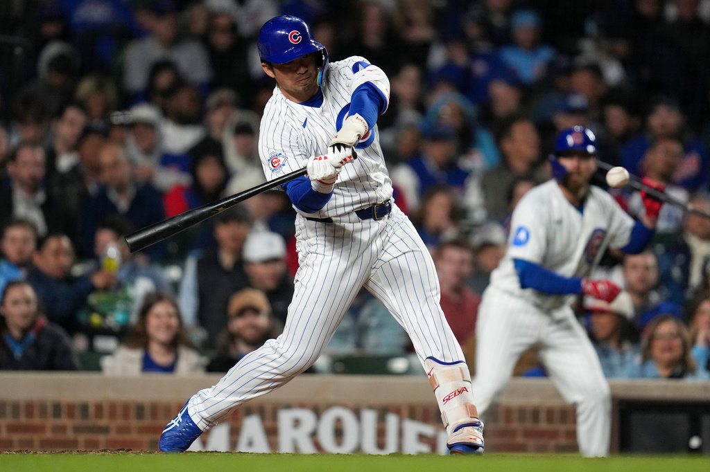 Chicago Cubs' Seiya Suzuki (27) hits a two-run home run during the fifth inning of a baseball game against the Philadelphia Phillies, Wednesday, April 22, 2026, in Chicago. (AP Photo/Erin Hooley)
