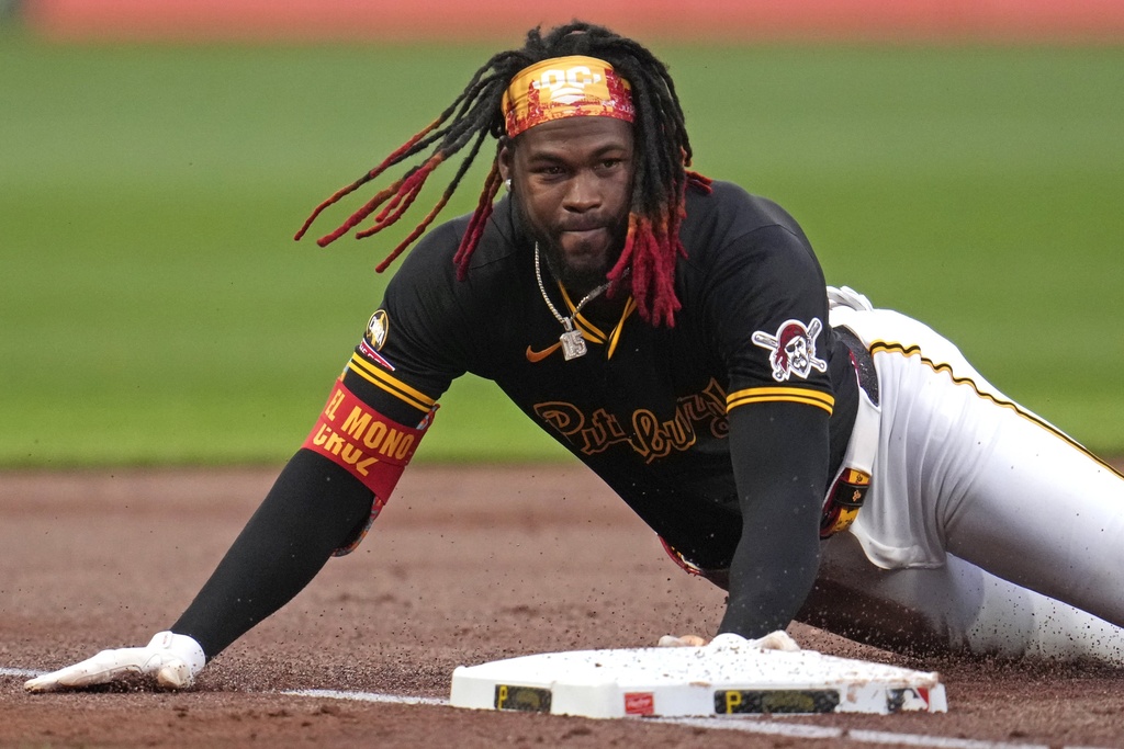 Pittsburgh Pirates' Oneil Cruz slides safely into third with a triple off Chicago Cubs pitcher Cade Horton, driving in a run, during the first inning of a baseball game in Pittsburgh, Tuesday, Sept. 16, 2025. (AP Photo/Gene J. Puskar)