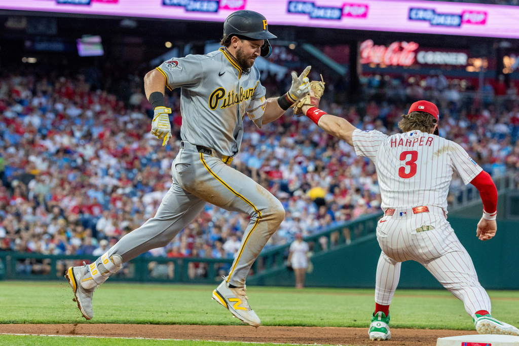 Pittsburgh Pirates' Jared Triolo is out at first as Philadelphia Phillies first baseman Bryce Harper (3) tags the base in the seventh inning of a baseball game, Tuesday, June 30, 2026, in Philadelphia. (AP Photo/Laurence Kesterson)