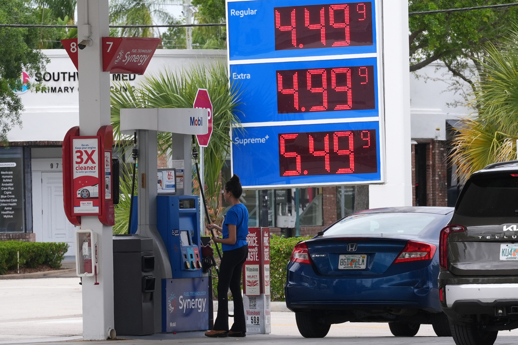 A customer pays for gasoline at a Mobil gas station, Wednesday, April 1, 2026, in Miami, Fla. (AP Photo/Marta Lavandier)