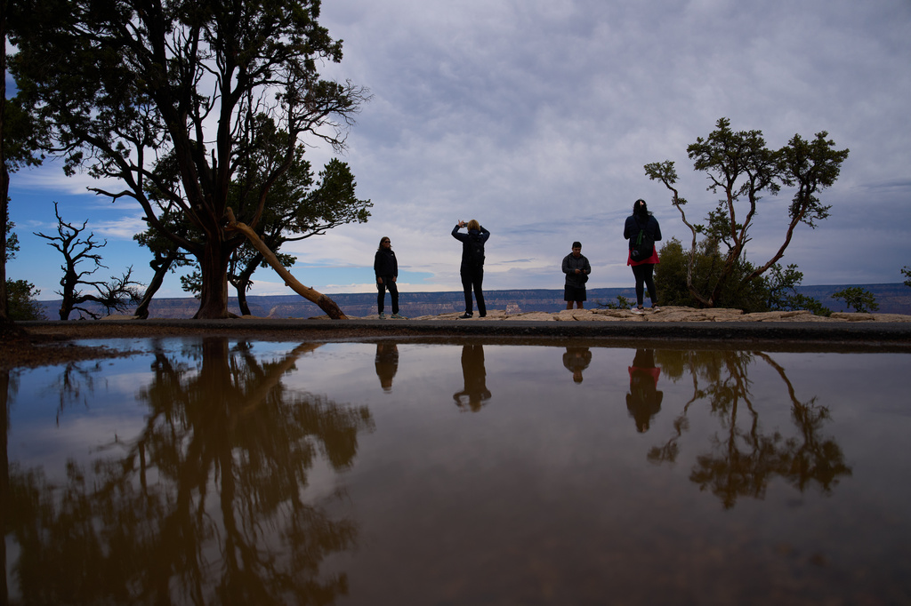 People stand at the rim of the Grand Canyon, Monday, Aug. 31, 2026, in Grand Canyon National Park, Ariz. (AP Photo/John Locher)