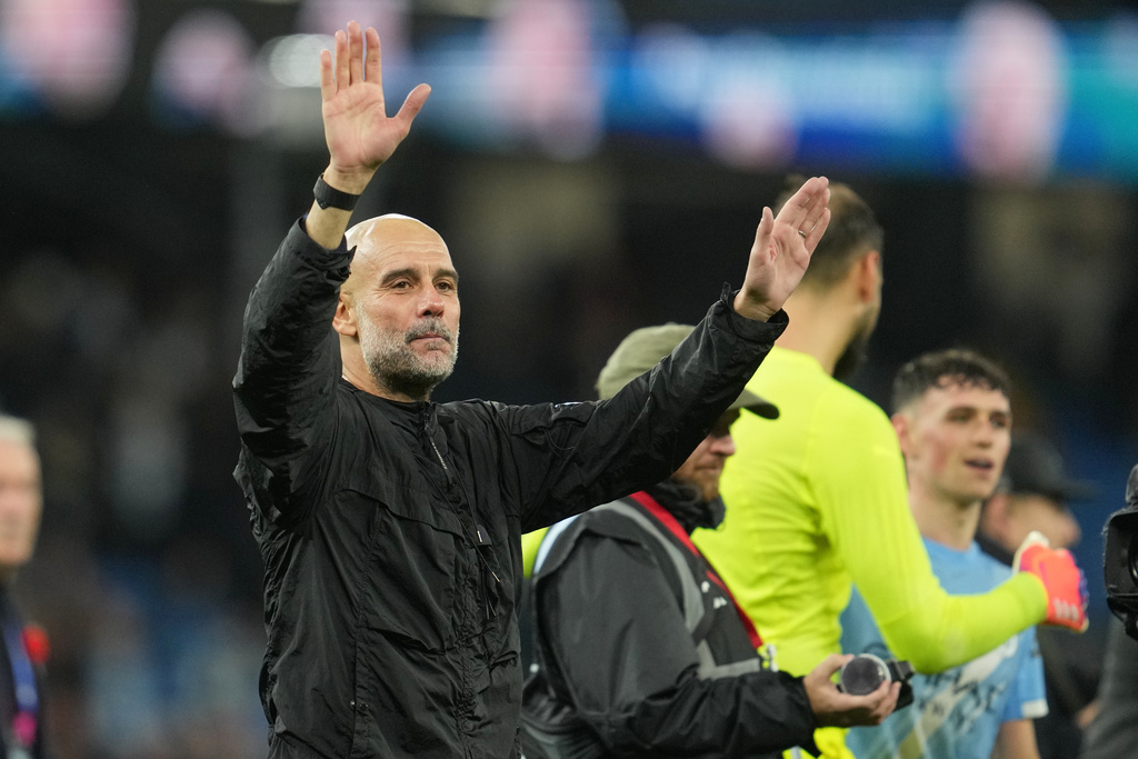 Manchester City's head coach Pep Guardiola leaves the field at the end of the English Premier League soccer match between Manchester City and Liverpool in Manchester, England, Sunday, Nov. 9, 2025. (AP Photo/Jon Super)