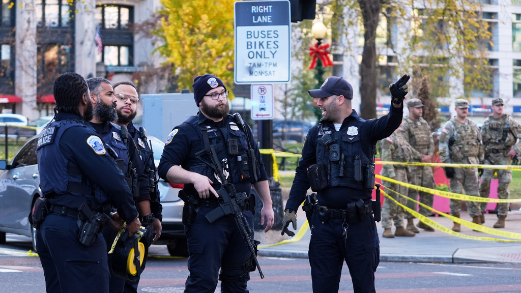 Washington Metropolitan Police are seen after reports of two National Guard soldiers shot near the White House in Washington, Wednesday, Nov. 26, 2025. (AP Photo/Evan Vucci)