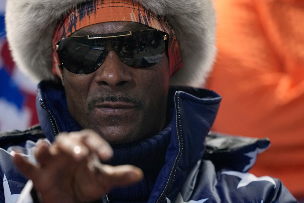 Snoop Dogg watches the men's 1,000 meters speedskating race at the 2026 Winter Olympics, in Milan, Italy, Wednesday, Feb. 11, 2026. (AP Photo/Ben Curtis)