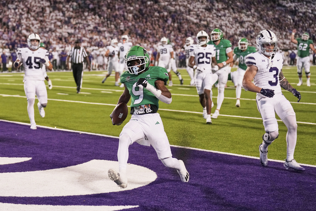 North Dakota running back Sawyer Seidl (9) runs into the end zone to score a touchdown during the second half of an NCAA college football game against Kansas State, Saturday, Aug. 30, 2025, in Manhattan, Kan. (AP Photo/Charlie Riedel)