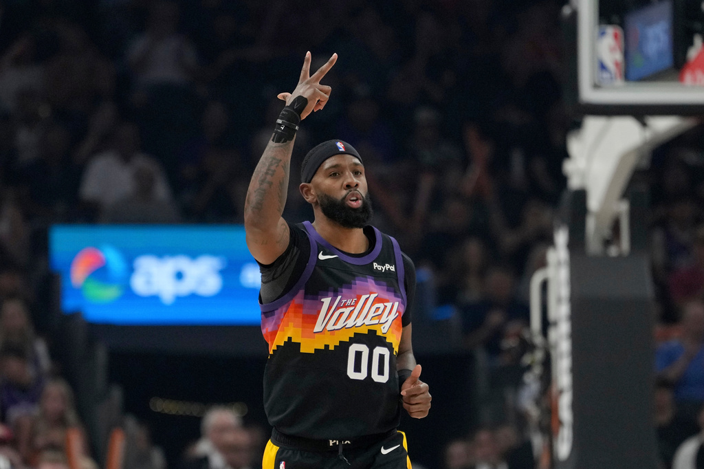 Phoenix Suns forward Royce O'Neale celebrates a 3-pointer against the Utah Jazz during the first half of an NBA basketball game, Saturday, March 28, 2026, in Phoenix. (AP Photo/Ross D. Franklin)