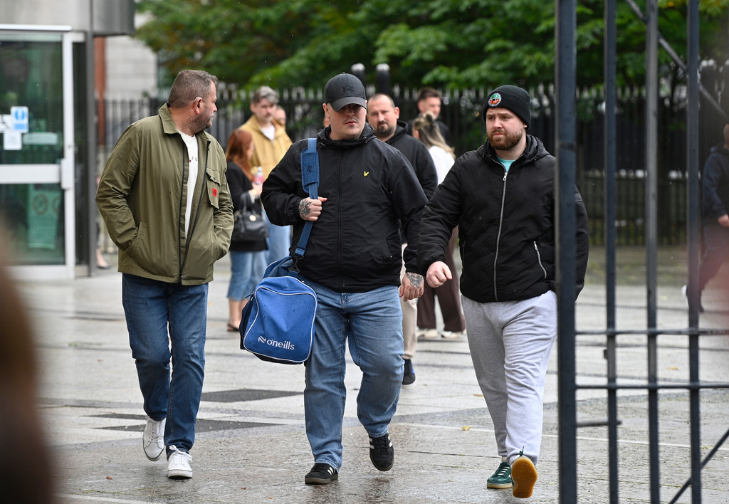 Jordan Gareth Devine (centre) outside Belfast Crown Court, after a non-jury trial of the murder of journalist Lyra McKee, Friday July 3, 2026. (PA via AP)