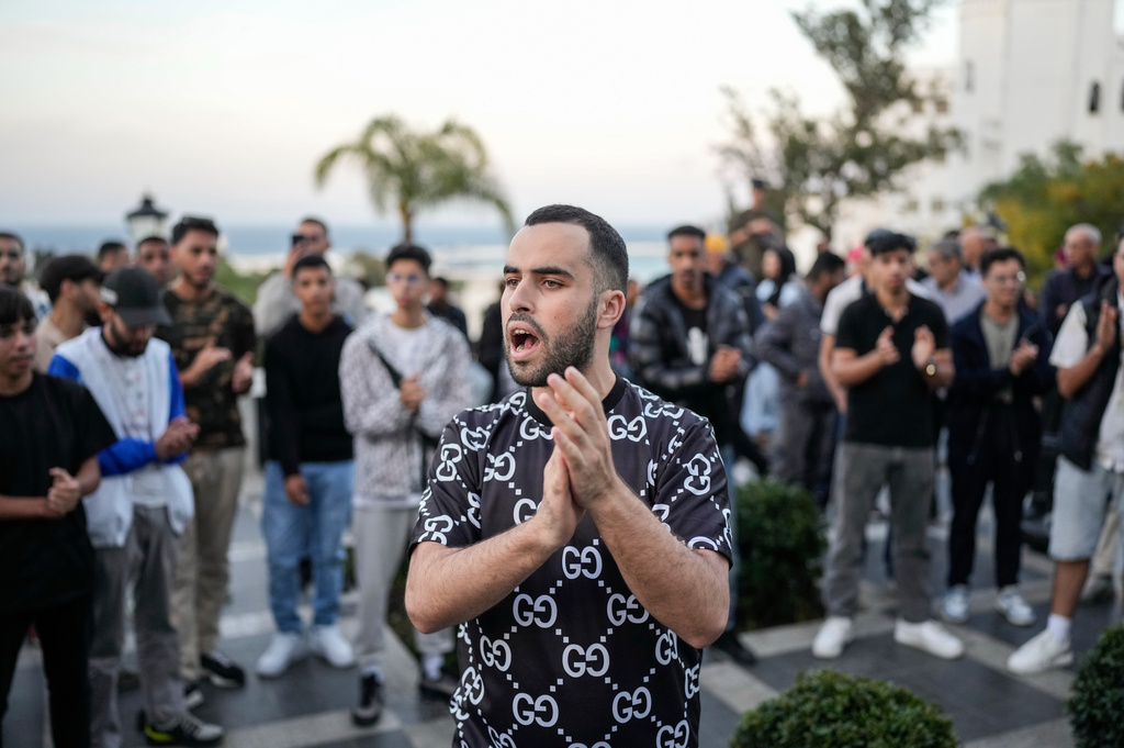 People take part in a youth led protest calling for education and healthcare reforms, in Tangier, Morocco, Saturday, Oct. 18, 2025. (AP Photo/Mosa'ab Elshamy)