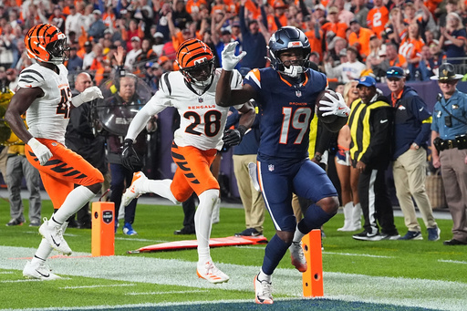 Denver Broncos wide receiver Marvin Mims Jr. (19) scores a touchdown against the Cincinnati Bengals during the first half of an NFL football game Monday, Sept. 29, 2025, in Denver. (AP Photo/David Zalubowski) Denver Broncos wide receiver Marvin Mims Jr. (19) scores a touchdown against the Cincinnati Bengals during the first half of an NFL football game Monday, Sept. 29, 2025, in Denver. (AP Photo/David Zalubowski)