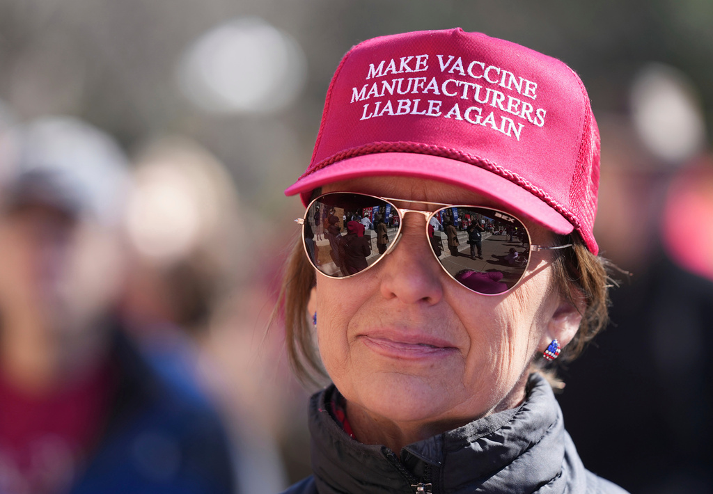 FILE - Angela Smith, of Fredericksburg, listens at the Freedom Fight for Vaccine Choice at the Capitol in Austin, Texas, on Jan. 25, 2023. ( Jay Janner/Austin American-Statesman via AP, File)