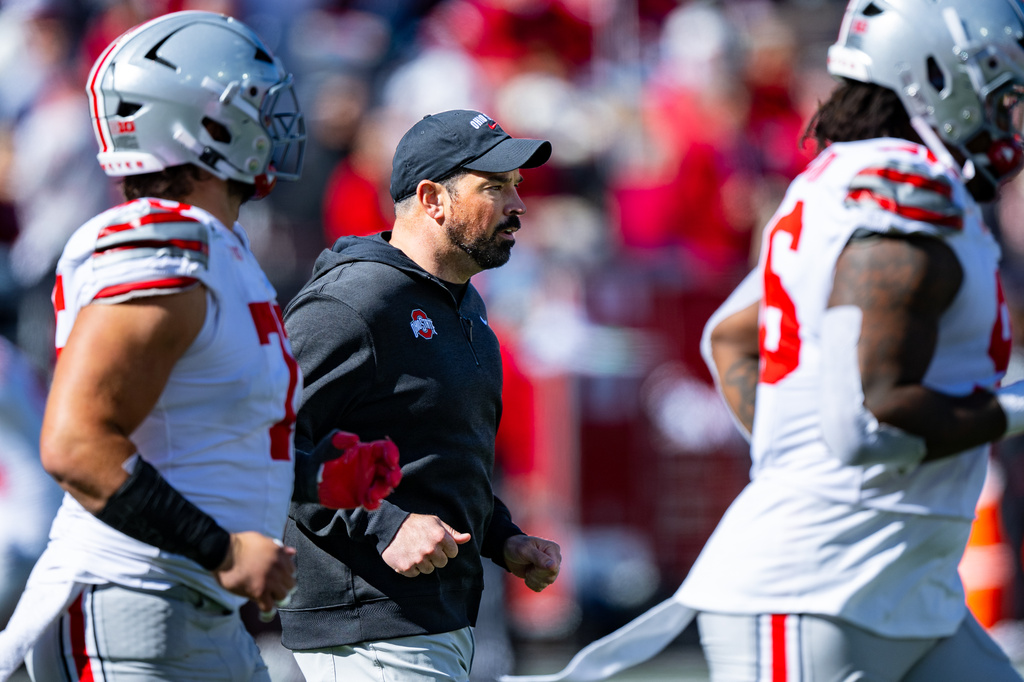 Ohio State head coach Ryan Day runs onto the field before the start of the second half of an NCAA college football game against Indiana, Saturday, Oct. 17, 2026, in Bloomington, Ind. (AP Photo/Doug McSchooler)