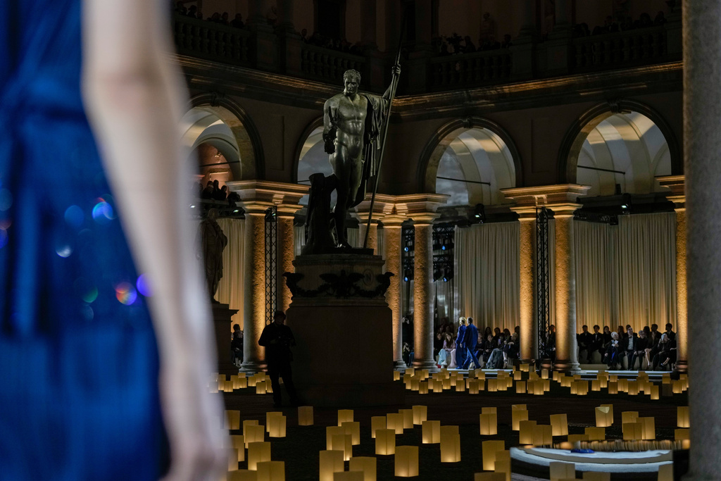 Models wear creations as part of the Giorgio Armani Spring/Summer 2026 collection show in Milan, Italy, Sunday, Sept. 28, 2025. (AP Photo/Luca Bruno)