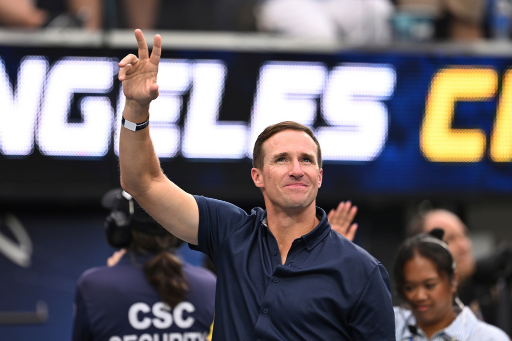 FILE - Drew Brees waves to the crowd during the first half of an NFL football game between the Los Angeles Chargers and the Denver Broncos, Sunday, Sept. 21, 2025, in Inglewood, Calif. (AP Photo/Carrie Giordano, file)